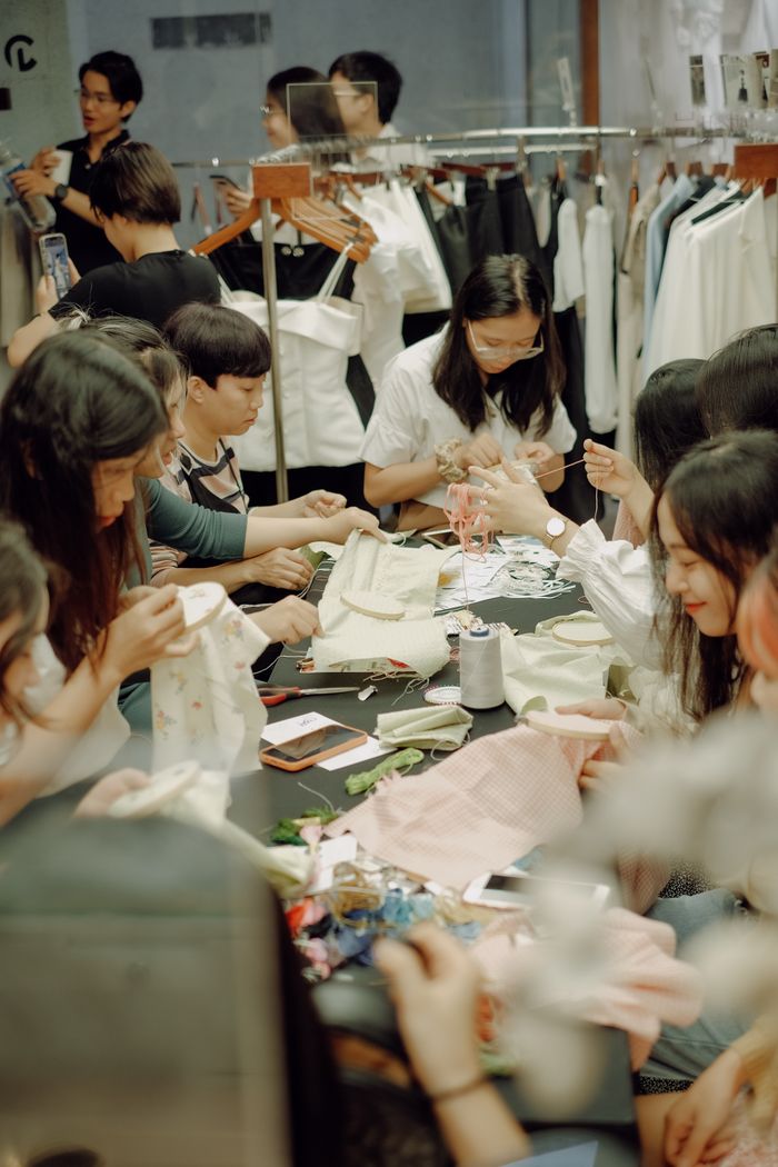 A group of women engaged in a sewing workshop, showcasing craft and collaboration.
