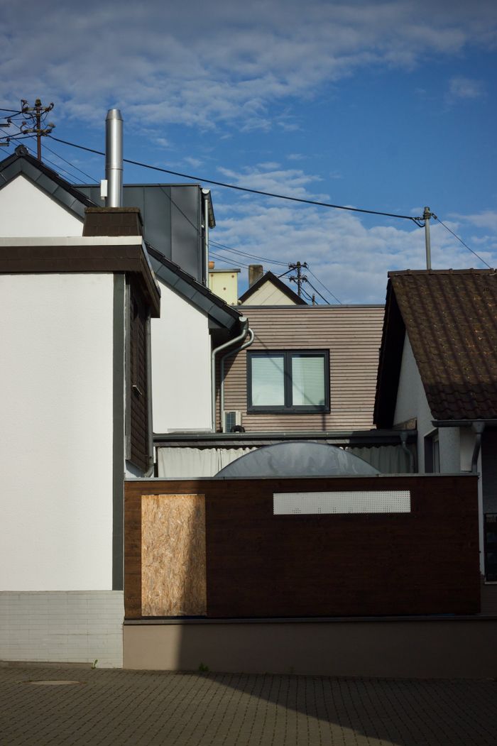 A picturesque view of modern suburban houses under a clear blue sky.